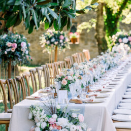 French-wedding-venue-persiqn-wedding-tablescape-long-tables-in-dusky-pink-blue-natural-tones